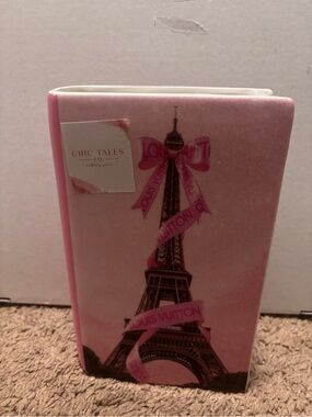 Louis Vuitton pink Eiffel Tower book shaped vase with pink ribbon